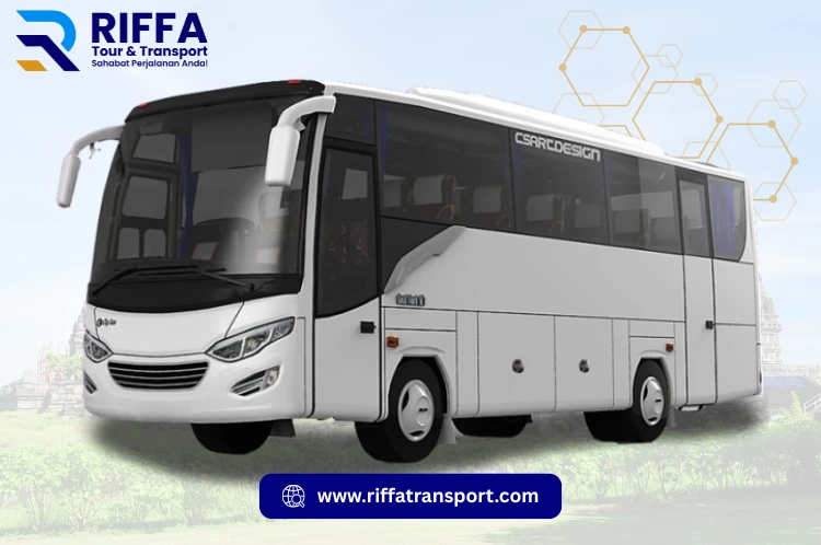 Bus Medium Pariwisata warna putih, layanan sewa bus Jogja RIFFA Tour & Transport background Candi Prambanan.